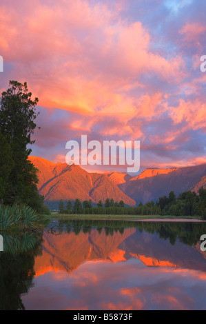 Sunset, Lake Matheson and Southern Alps, Westland, South Island, New Zealand, Pacific Stock Photo