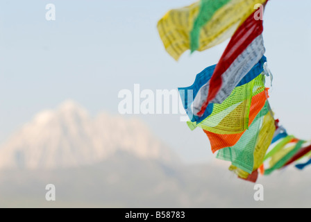 Prayer flags blowing in wind, Snow mountain, Tagong, Sichuan, China, Asia Stock Photo