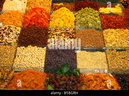 Colourful pick and mix selection of dried fruits and nuts in La Boqueria Market, La Rambla, Barcelona, Spain Stock Photo
