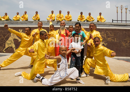 Kung fu students displaying their skills at a tourist show within Shaolin Temple, Shaolin, Henan Province, China Stock Photo