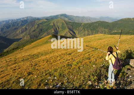 Mountain scenery and female hiker at Wutaishan one of China's sacred Buddhist mountain ranges, Shanxi province, China Stock Photo