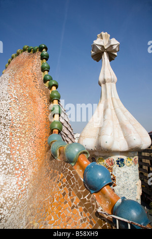 Bizarre chimneys and roof jut from the roof of Casa Batlló, Anton Gaudí's Modernist apartment house in Barcelona Stock Photo