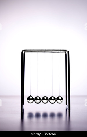 Newtons cradle office game balls Stock Photo