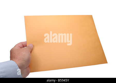 Handing a large plain brown envelope Stock Photo