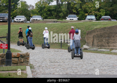 People riding segway personal transporters Stock Photo