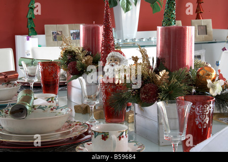 Table laid with Christmas decorations tableware and ornaments in Brisbane Queensland QLD Australia Stock Photo