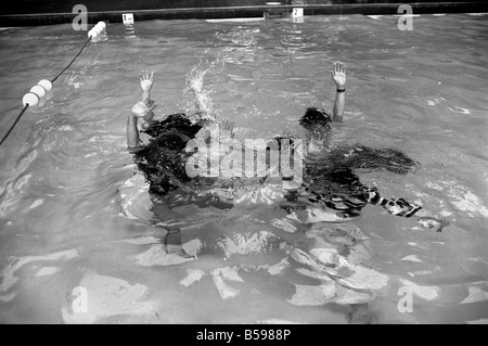 The Bay City Rollers celebrate their chart success with a quick dip in the pool. The Rollers are Scottish Pop/rock band.. Their Stock Photo