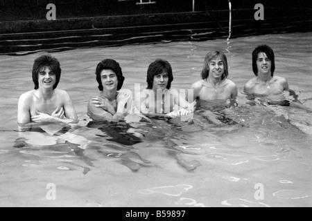 The Bay City Rollers celebrate their chart success with a quick dip in the pool. March 1975 Stock Photo