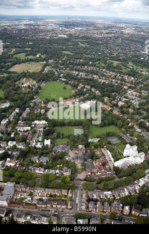 Aerial view west of Hampstead Heath Highgate School playing field sports ground suburban houses tower blocks London N6 England U Stock Photo