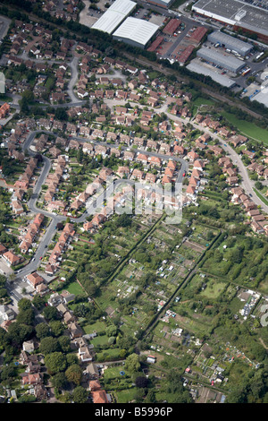 Aerial view north west of suburban houses allotments Torvill Drive railway line business park Wollaton Nottingham UK High level Stock Photo