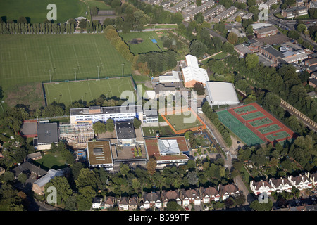 Aerial view north east of Dulwich High School playing fields football pitch tennis courts suburban houses London SE22 England UK Stock Photo