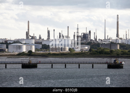 Fawley oil refinery port and natural gas terminal and storage depot tanks near Hythe Southampton Water England UK Stock Photo