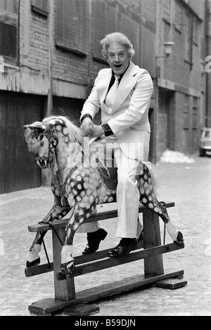 Wrestler Jackie Pallo poses with a rocking horse. &#13;&#10;February 1975 &#13;&#10;75-01087-007 Stock Photo