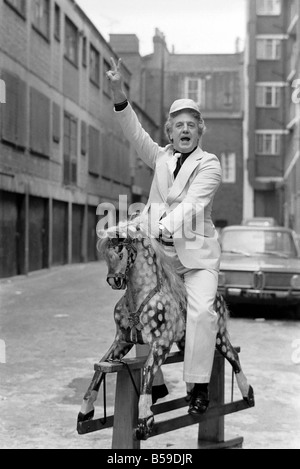 Wrestler Jackie Pallo poses with a rocking horse. &#13;&#10;February 1975 &#13;&#10;75-01087-008 Stock Photo