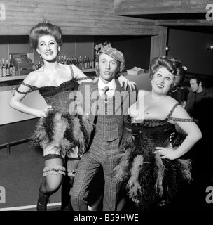 Sing a Rude Song: It is a musical about Marie Lloyd starring Barbara Windsor, Maurice Gibb, Denis Quilley, taking place at the Greewich Theater. The muscial opens on Wednesday, 18th February and Annie Wood - Marie Lloyd's only surviving sister hopes to be present. Left to right: Judy Bowen, Maurice Gibb and Veronica Clifford in an unequal sister act. February 1970 70-1601-010 Stock Photo