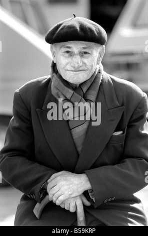 An old man of Paris wearing beret, scarf and coat on a coald day in France&#13;&#10;April 1975 &#13;&#10;75-2099-006 Stock Photo