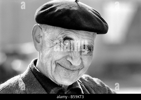 An old man of Paris wearing beret, scarf and coat on a cold day in France&#13;&#10;April 1975 &#13;&#10;75-2099-009 Stock Photo