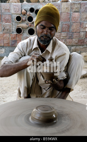 Traditional village Indian potters livelihood, throwing pots out of one