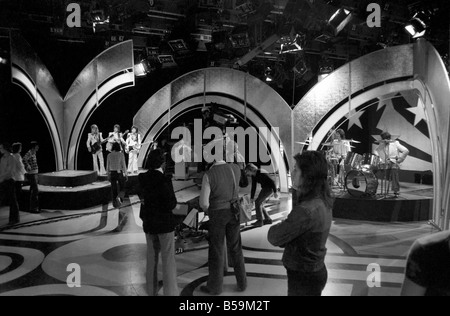 Filming of the television music chart show Top of the Pops at the BBC Studios. Pop group 10cc performing on stage April 1975 Stock Photo