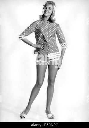 Model Jo Waring wearing a polka dot patterned top and three quarter ...