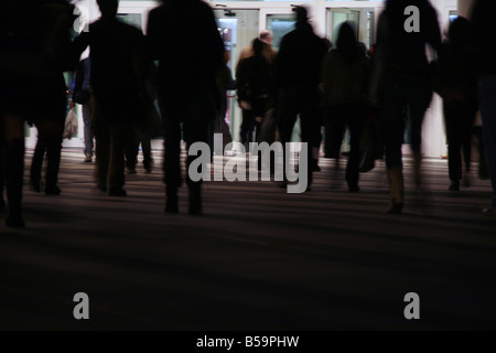 crowd of people walking in street at night Stock Photo