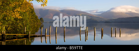 View over submerged landing stage at Derwentwater towards Skiddaw & Blencathra in Autumn, Keswick, Lake District, Cumbria Stock Photo