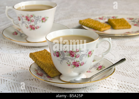 Traditional English cup of tea with biscuit Stock Photo
