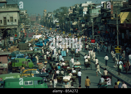 Busy street in Old Delhi looking towards Red Fort in distance Delhi India Asia Stock Photo