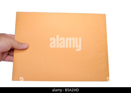 Handing a large plain brown envelope Stock Photo