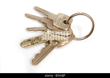 Bunch of house keys isolated on a white studio background Stock Photo