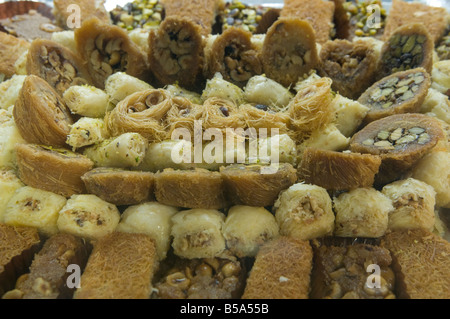 Pile of decorated sweet Baklava delights.with richly of pistachio nuts Egypt Stock Photo