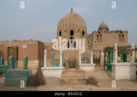 Dense grid of tomb and mausoleum Islamic structures in the City of the Dead or Cairo Necropolis where some people live in southeastern Cairo, Egypt. Stock Photo