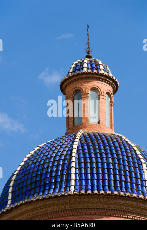 Blue ceramic tiled church dome in the old historical centre of El Carmen in Valencia Spain Stock Photo