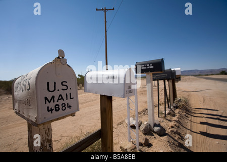 Row of US mailboxes on the roadside. Stock Photo