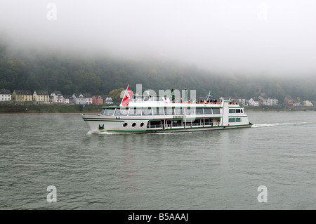 Germany; pleasure boat on the Rhine near Koblenz on a foggy morning. Stock Photo