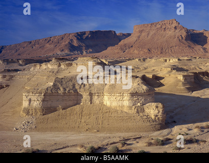 Rock cliffs and sand dunes in front of the fortress of Masada, in the Judean Desert, Israel, Middle East Stock Photo