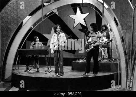 Filming of the television music chart show Top of the Pops at the BBC Studios. Pop group 10cc performing on stage April 1975 Stock Photo