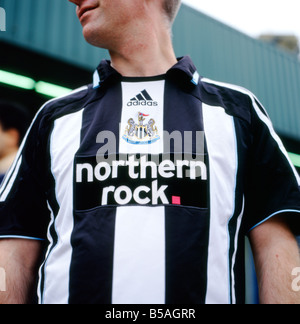 Wearing a newcastle united shirt hi-res stock photography