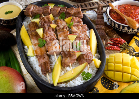 Madagascan food, mosakiki, zebu skewers with mango and rice, Madagascar, Africa Stock Photo