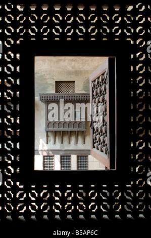 Egyptian style Mashrabiya oriel windows enclosed with carved wood latticework inside the Khanqah of Sultan Al-Ghuri Complex in old Cairo Egypt Stock Photo