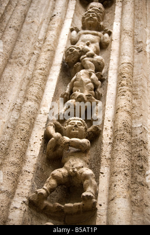 Detail of stone carved figures around the doorway of La Lonja de la Seda formally a commodity exchange Valencia Spain Stock Photo