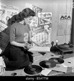 Kathleen Craig juke box queen who selects records for jukeboxes. 1956 A516-012 Stock Photo