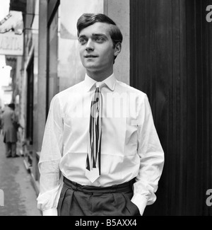 Men modelling the latest 1963 menswear design's in the streets of Paris