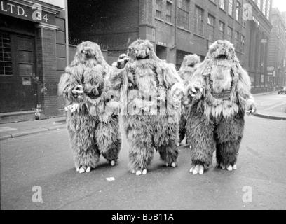 The Yeti Mark two - seven foot tall monsters with light eyes, electrical nervous system, electronic roars, and assisted by a fungoid mist have taken over London for the TV series Dr Who. The yeti's are played by actors Gordon Stothard, John Lord, Colin Warman and John Levene, wearing suits made from Yak fur and wool with eyes that light up.;Our Picture Shows: An anxious moment for a boxer dog when he meets up with the Yeti's near Goodge Street underground station in London. Dec 1967;X11800 Stock Photo