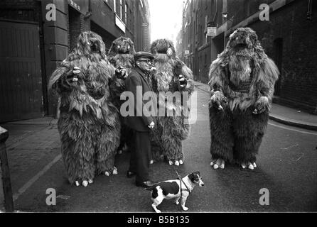 The Yeti Mark two - seven foot tall monsters with light eyes, electrical nervous system, electronic roars, and assisted by a fungoid mist have taken over London for the TV series Dr Who. The yeti's are played by actors Gordon Stothard, John Lord, Colin Warman and John Levene, wearing suits made from Yak fur and wool with eyes that light up.;Our Picture Shows: An anxious moment for a jack russell dog when he meets up with the Yeti's near Goodge Street underground station in London. Dec 1967;X11800 Stock Photo