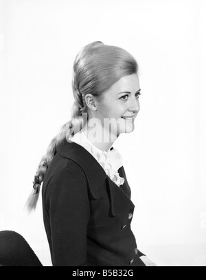 Woman at the beauty department of Selfridges store having a Tovar- tress attached to her hair. 1966 Stock Photo