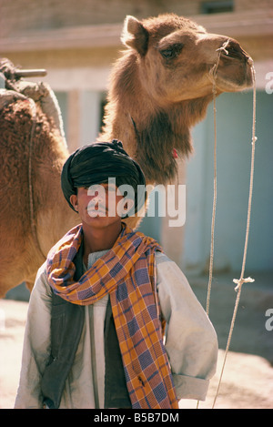 Young man and camel Sibi Pakistan Asia Stock Photo