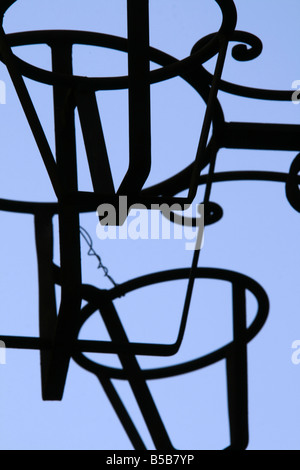 detail of metal plant pots holder against blue sky Stock Photo