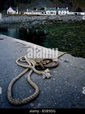 Rope and rusted ring on the jetty at Ellenabeich, Isle of Seil, Argyll, Scotland, UK. Stock Photo