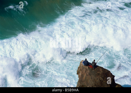 Fishermen on rocks, Tonal Beach, Sagres, Algarve, Portugal, Europe Stock Photo